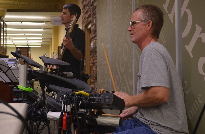 Alan Perry of the band Limewater plays the drums during the bands performance at Taste of Gulf Gate.