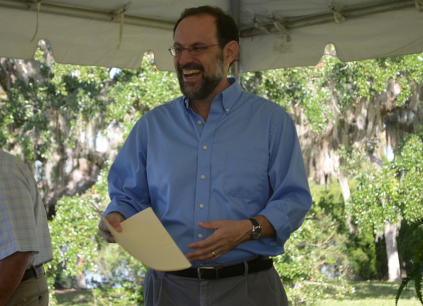 New College Professor of Archeology Uzi Baram laughs with New College students before the program began on Saturday. Baram led archeological digs on the site in January and spoke to attendees  about the importance of preserving its history.