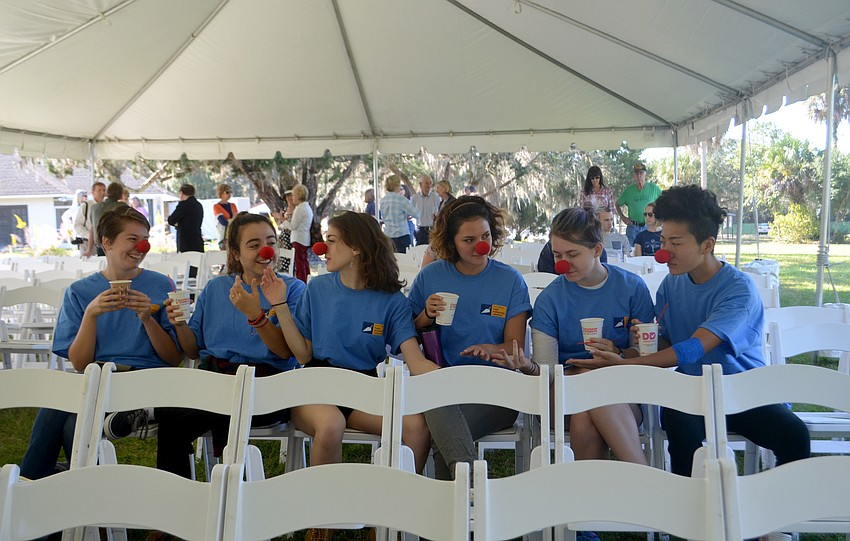 Oriana Reilly, Ximena Pedroza, Rachel Ceciro, Donnella Aldrich,  McKenzie Cameron and Haiwen Yu show off their red clown noses. The noses were left over from the debut of the Circus! photo exhibit, which opened in the Edson Keith Manson on Friday night.