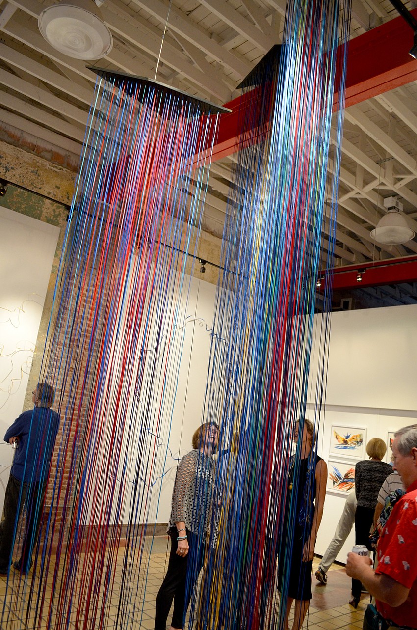 Guests admire the ribbon installation.