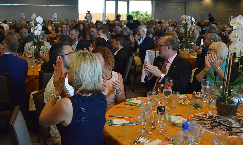 Attendees clap for Daniel Solowey, Sarasota Youth Orchestra clarinet player.
