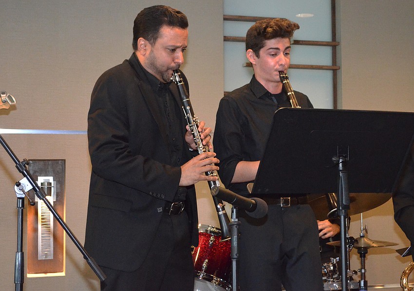 Bharat Chandra, Principal Clarinet for the Sarasota Orchestra, performs with his Sarasota Youth Orchestra student Daniel Solowey.