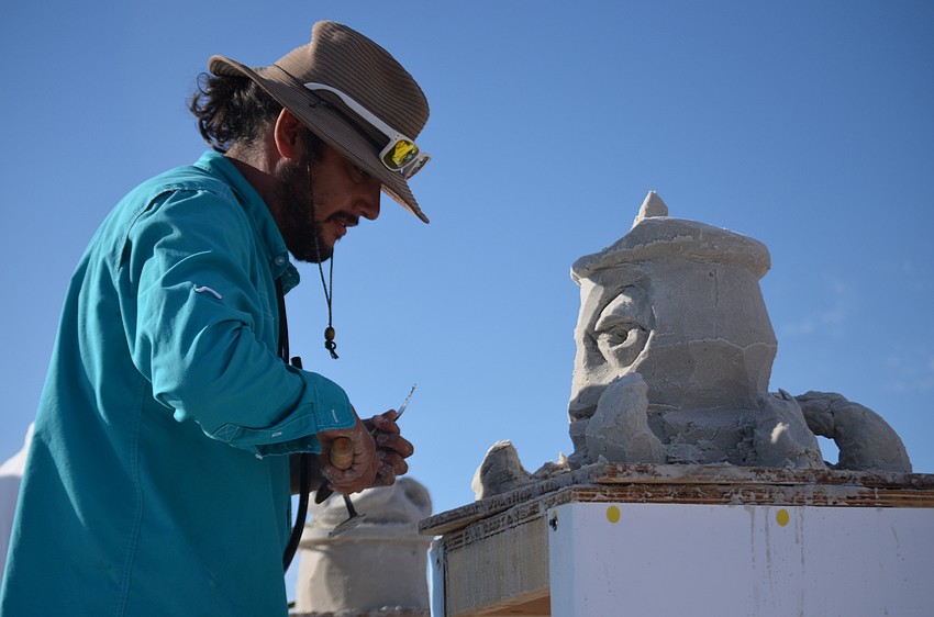 Albert Lucio competes against Andy Daily (not pictured) in the Quick Sand competition on Saturday. Lucio and Daily were charged with sculpting an octopus with a hat in under 10 minutes.