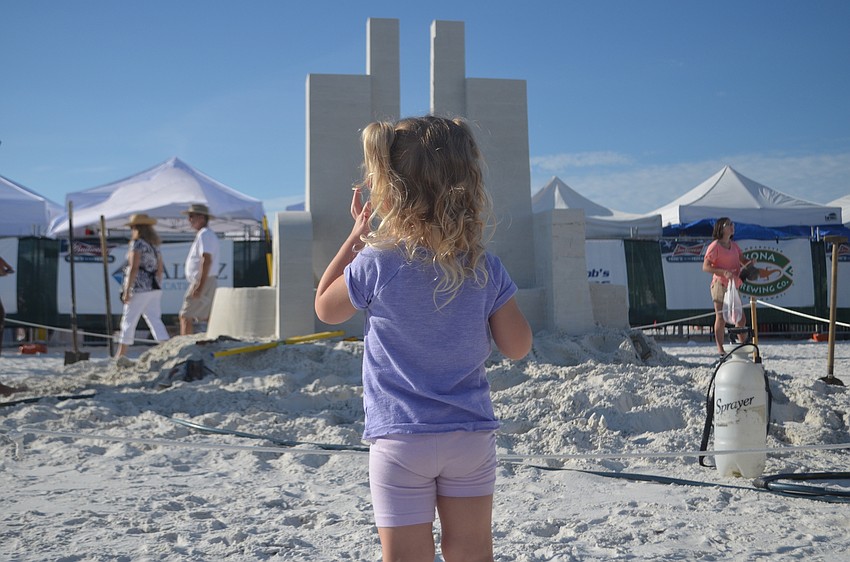 Reese Maker stands in front of Jan Zelinka and Rodovan Zivny's submission called 