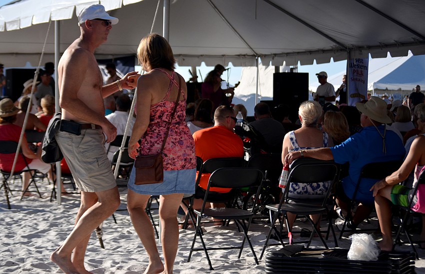 Mike and Sue Ziebell dance outside the live music tent.