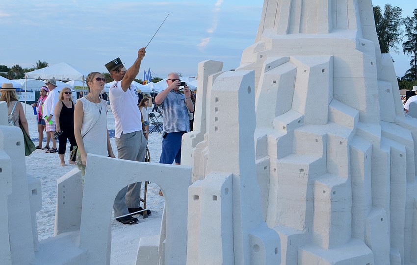 Sarah Ziebro and James Van Thach admire the master's submissions to the Siesta Key Crystal Classic.