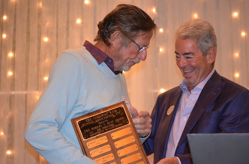 Larry Straff and Larry Coleman share a laugh as Straff accepts the Robert T. Ruff.