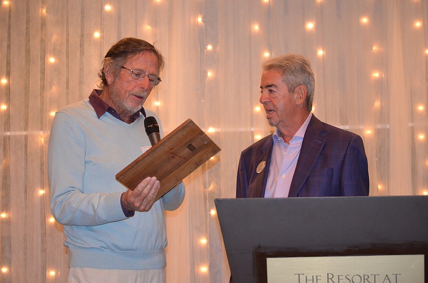 Larry Straff accepts his award at the Longboat Key Club Tennis Association’s Fall Frolic.