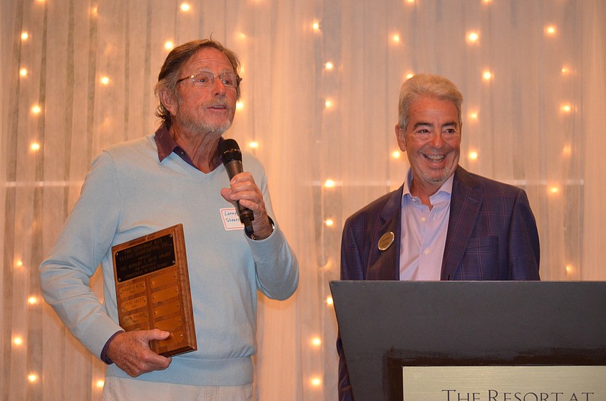 Larry Straff accepts his award at the Longboat Key Club Tennis Association’s Fall Frolic.