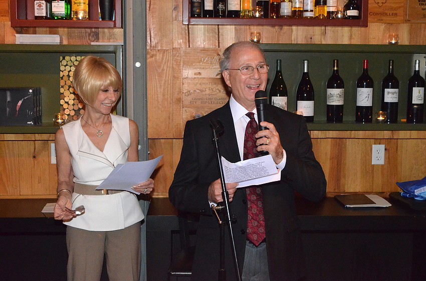 Chairwomen Debbie Haspel and Chairman Larry Haspel laugh as they introduce Scott Anderson to begin the roast.