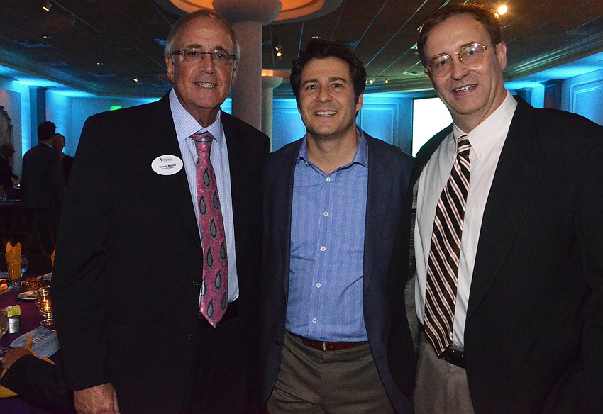 Randy Mallitz, board president, with Dr. Steven Fineman and Dr. Sean Downing
