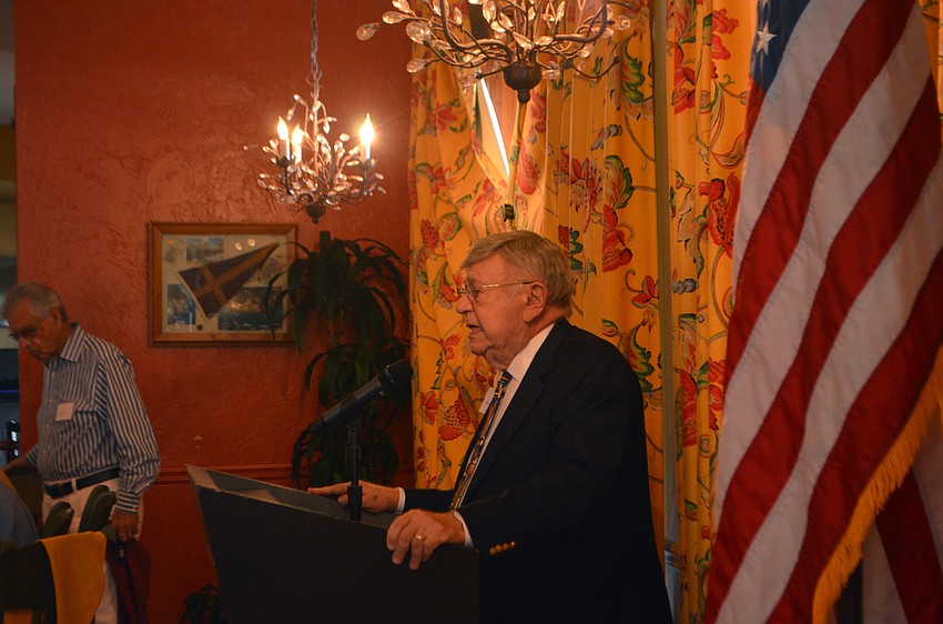 Murray Blueglass, club president, welcomes members to the monthly luncheon on Nov. 16.