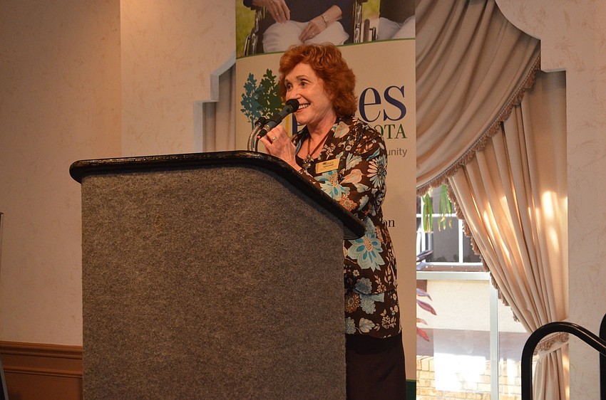 Pines of Sarasota Foundation President Estelle Crawford welcomes guests.