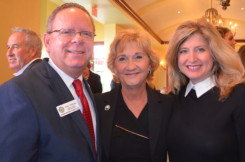 Gary Tibbetts, Vanessa Baugh and Heather Kasten mingle.