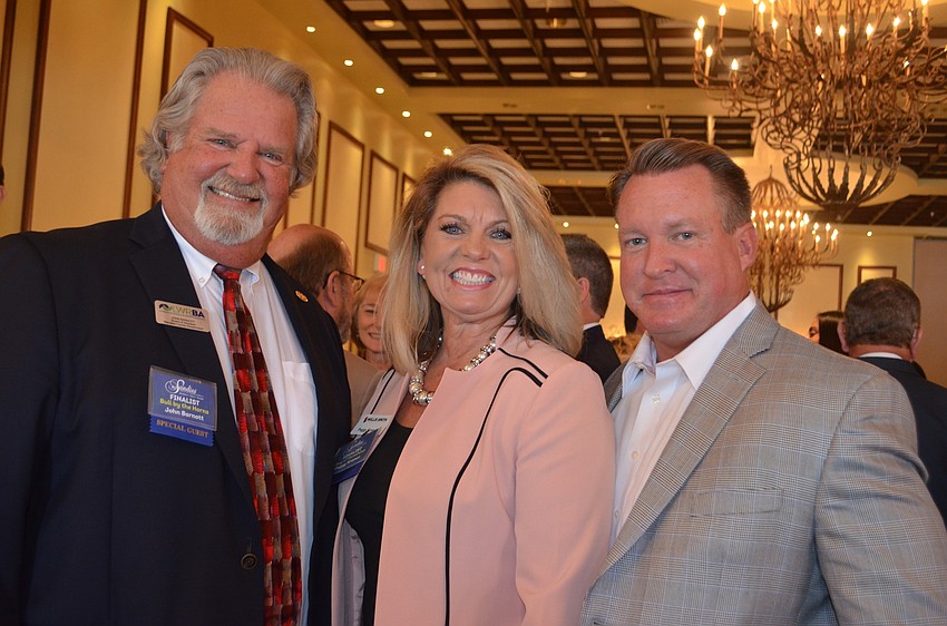 John Barnott, Peggy Kronus and Jerry Lamb network before the 2016 Sandies Awards.