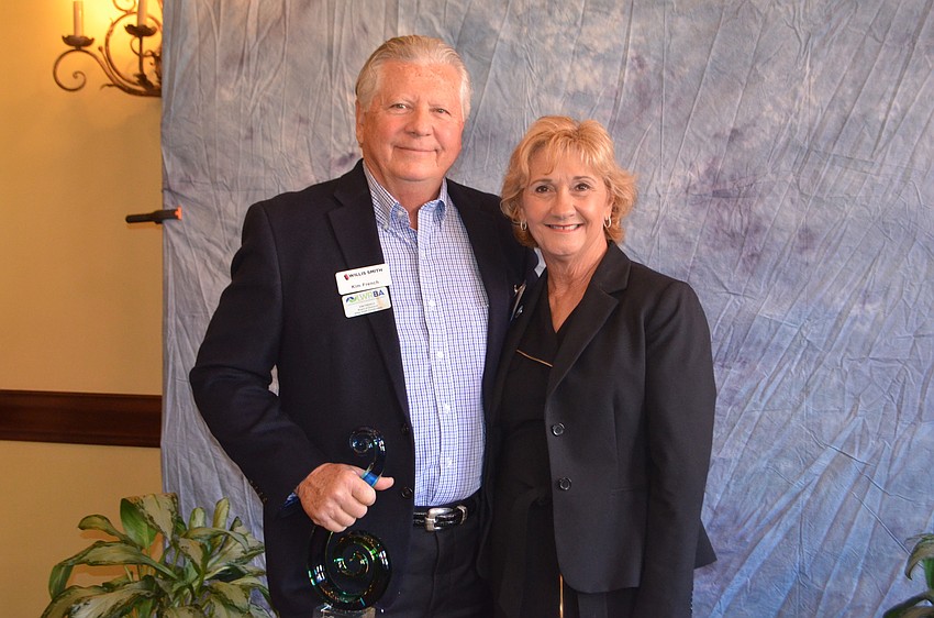 Kim French of Willis Smith Construction poses with Commissioner Vanessa Baugh after winning the 