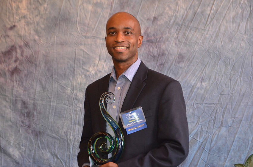 Jonathan Marsh, Home Helpers of Bradenton, holds his award after being declared the Lakewood Ranch Business Alliance's 