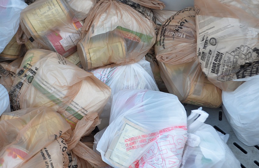 In addition to receiving a turkey, turkey-drive recipients were also given Thanksgiving sides for four.