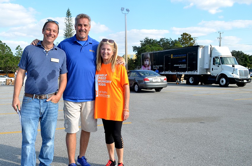 All Faiths Food Bank Senior Director of Marketing Beau Wilberding, Chief Operating Officer John Livingston and  CEO Sandra Frank.