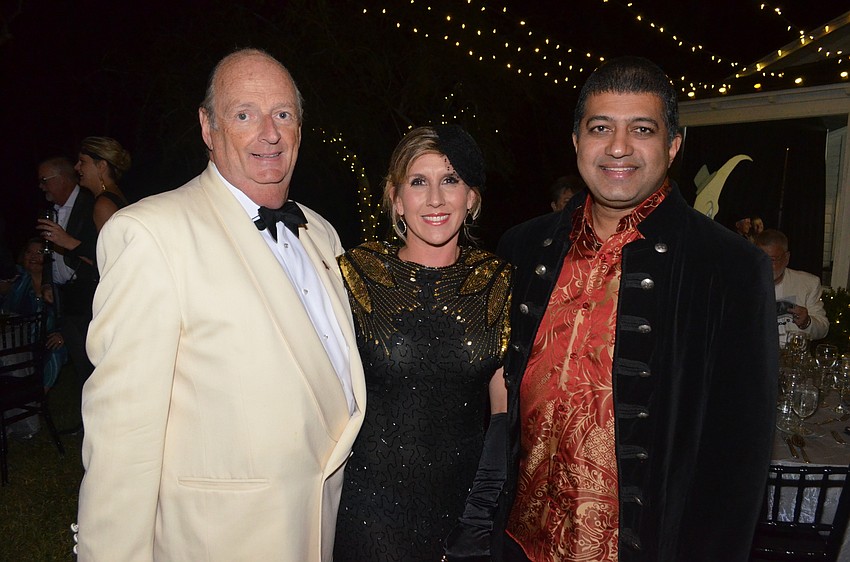 John Mason, executive director, with Becky and Shay Atluru