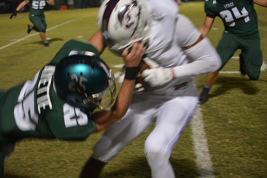 Braden River senior wideout Taj Speights gets his face mask pulled by a Venice defender. No penalty was called.