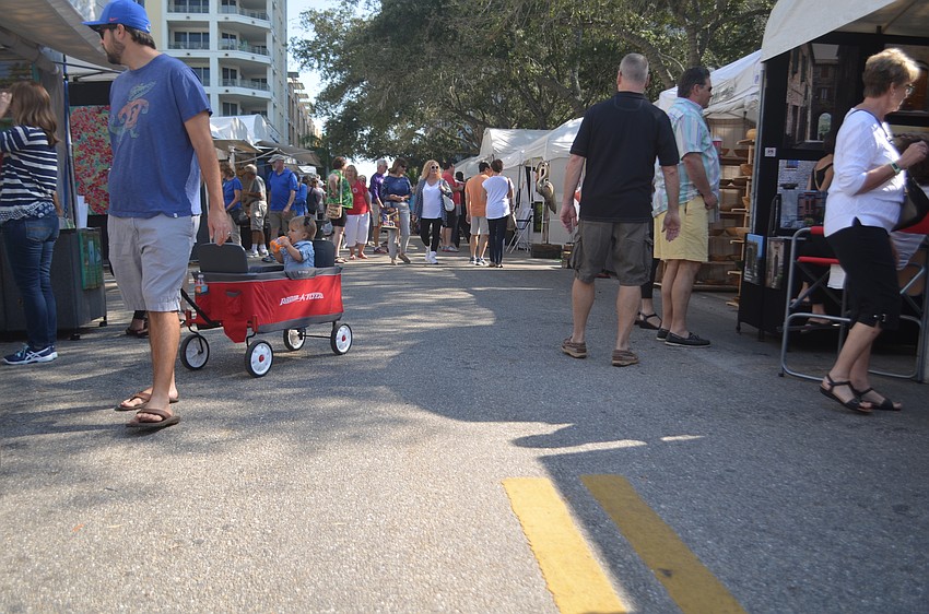 Booths lined First Street in front of Selby Public Library for the Sarasota Fall Fine Art Festival.