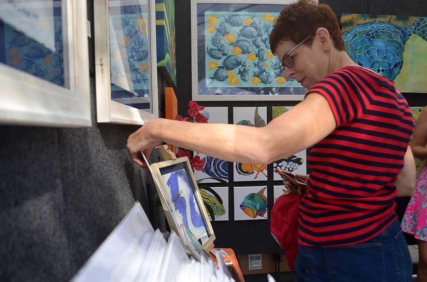 Bonnie Korsgaard browses through Michele Nicole Lowe's marine-inspired artwork.