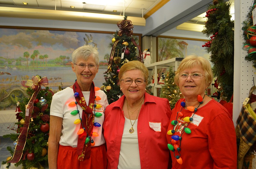 Bazaar organizers Clara McGonigle, Andy Youngs and Carol Fischbein