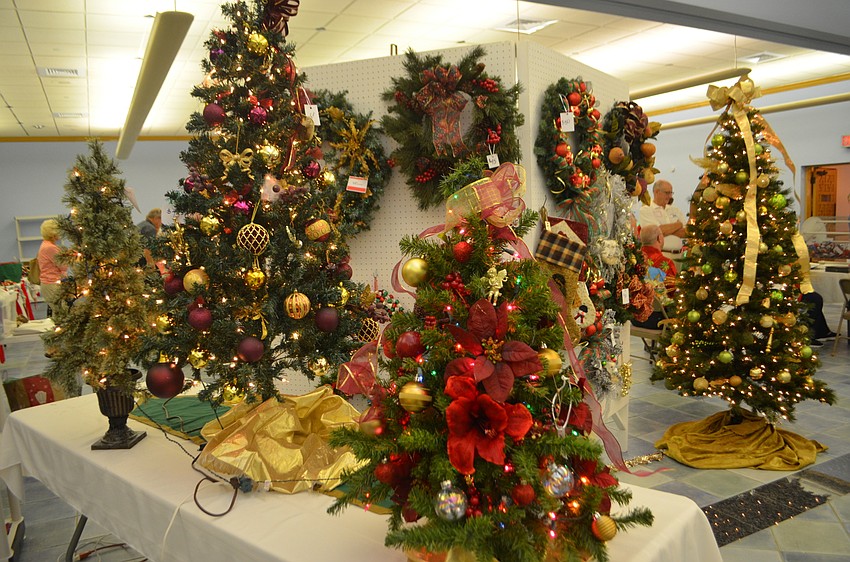 Decorated Christmas trees were on display and for sale at the St. Mary Christmas Bazaar. The women’s guild began planning the event in June.