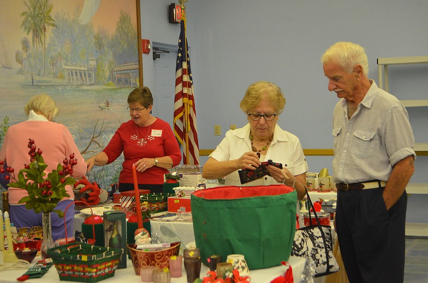 Anne and Carl Sferra, right, look at Christmas decorations during the St. Mary Christmas Bazaar on Nov. 19.