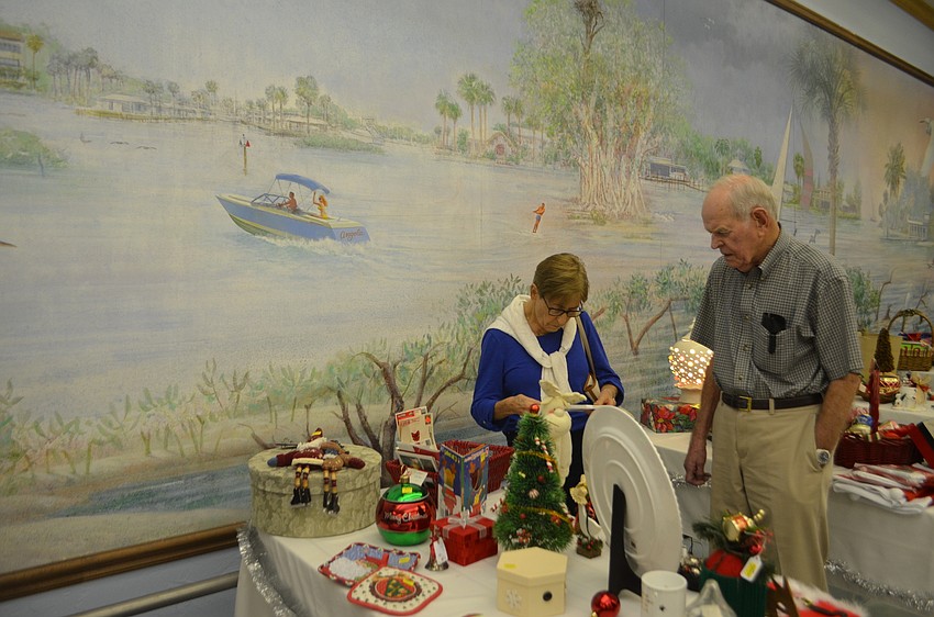 Luise and Emil Widitz check out the Christmas decoration on sale during the St. Mary Christmas Bazaar on Nov. 19.