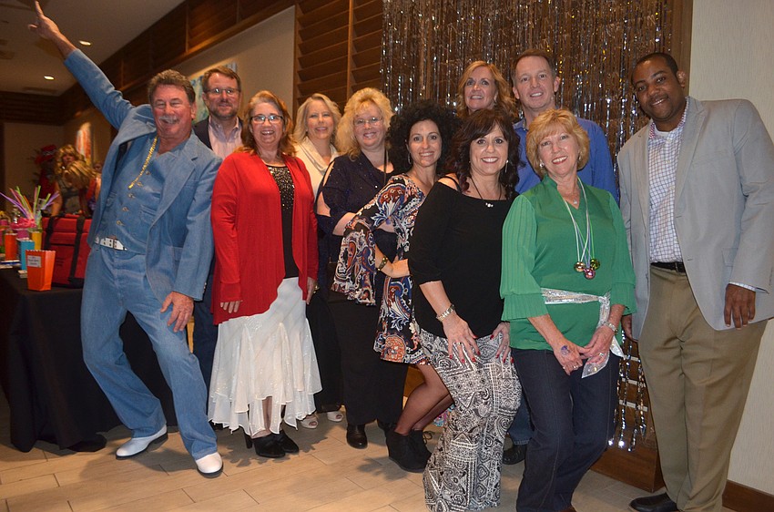 Riverview Foundation board members Steve Martin, Pete Norden, Cyndi Forgeur, Carrie De Zutter, Vivian Yack, Hali Bloom, Jeanne Amour, Natalie Twigg, John Sinclair, Kathy Collums and Riverview High School Principal Paul Burns.