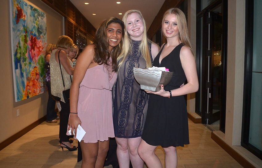 Riverview students Christine Jagannath, Victoria Gowan and Jasmine Eastman volunteered at the event.