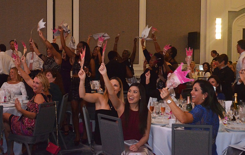 Ladies show their support for their solemen as the men are announced.