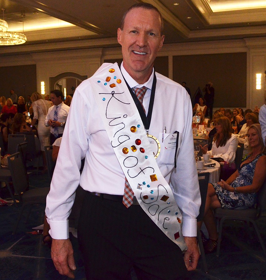 Taber Chadwick shows off his “King of Sole” award, which he won by receiving the most votes for best soleman.