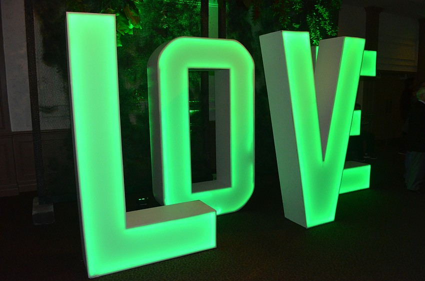 The “LOVE” sign that is popular at many Michael’s On East events glowed green in accordance with the “enchanted forest” theme.