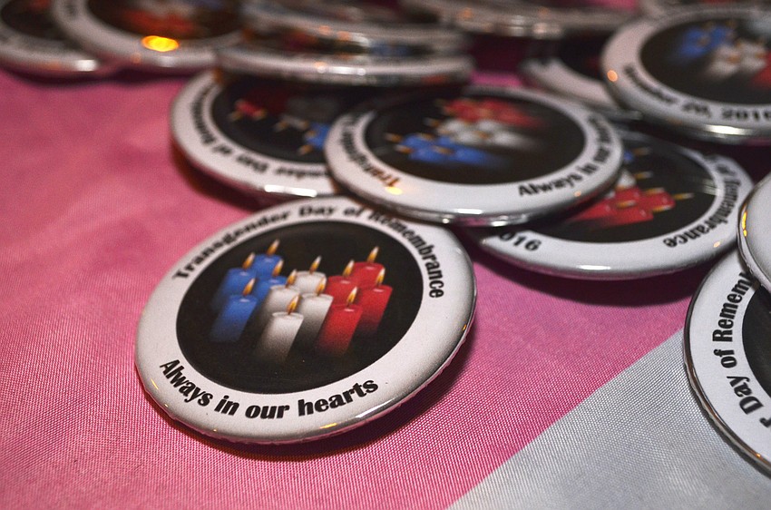 Attendees were handed buttons in honor of Transgender Day of Remembrance upon their arrival at the venue.