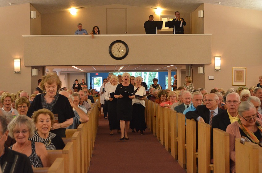 An interfaith choir with members from each place of worship sang throughout the service.
