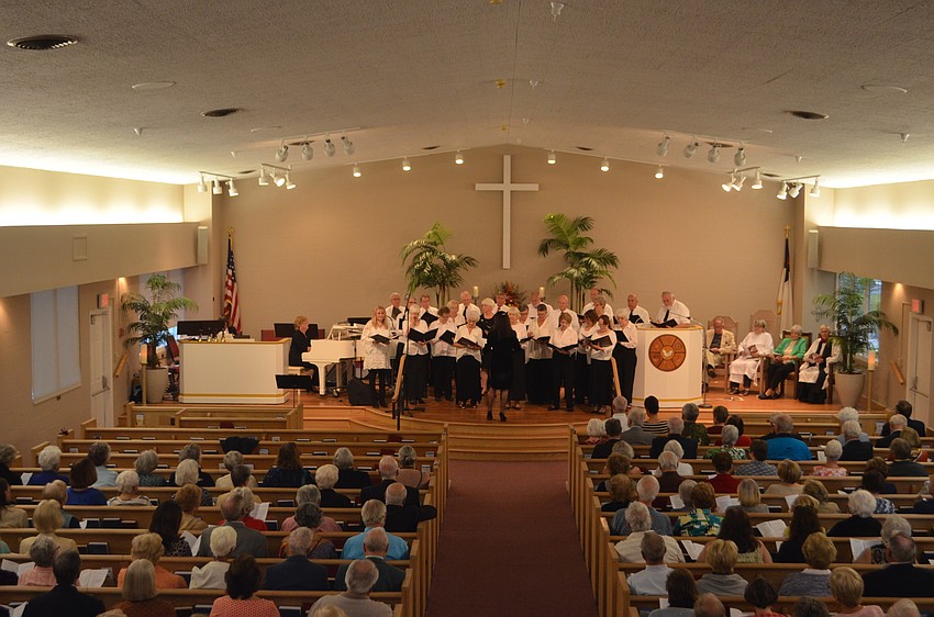An interfaith choir with members from each place of worship sang throughout the service.