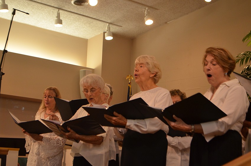 An interfaith choir with members from each place of worship sang throughout the service.