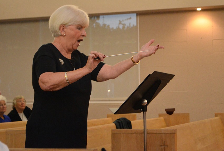 Jane Hunder of St. Armands Key Lutheran Church directs the interfaith choir.