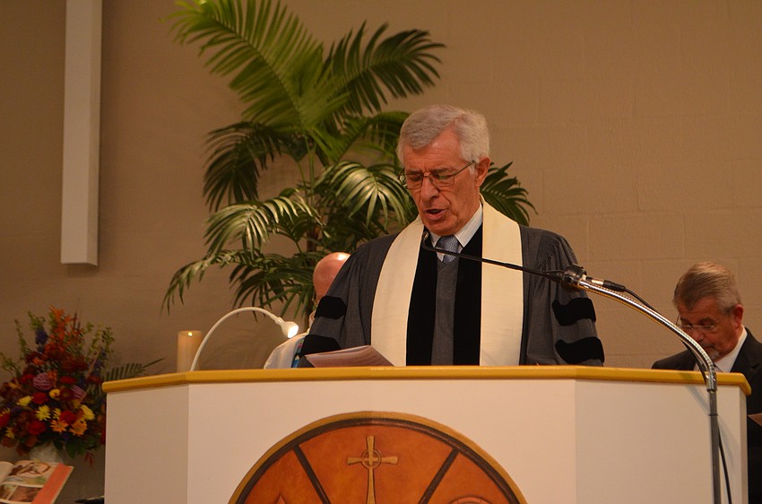 Rev. Norman Pritchard of Christ Church says the offering prayer during the Thanksgiving Interfaith Service on Nov. 22. Rev. Norman Pritchard of Christ Church says the offering prayer during the Thanksgiving Interfaith Service on Nov. 22.