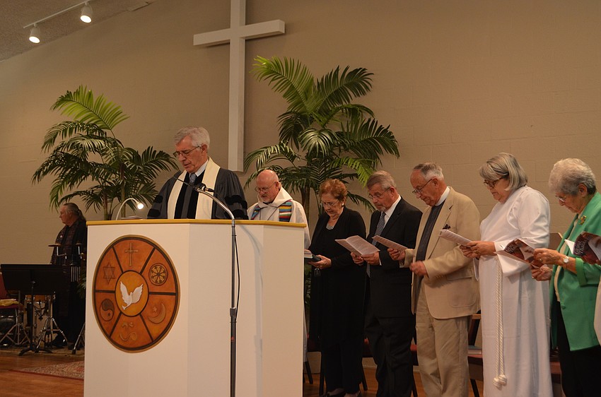 Rev. Norman Pritchard of Christ Church says the offering prayer during the Thanksgiving Interfaith Service on Nov. 22.