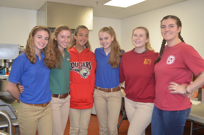 Cardinal Mooney High School Students Lauren France, Caitlin Telford, Laura Dowden, Leah Roddenberry, Gavin Schrantz and Kate Beck volunteered to serve at the luncheon.