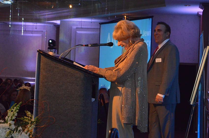 Flori Roberts recites the motzi blessing before dinner.