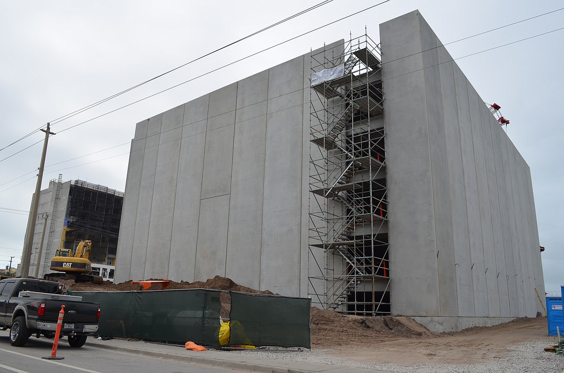 The concrete structure visible on the Urban Flats site is a parking garage that will eventually be covered by apartments.