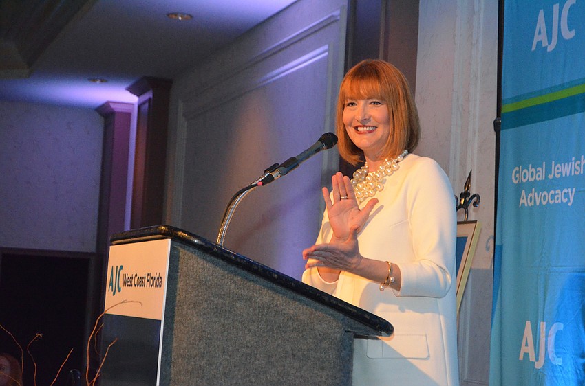 Emily Walsh applauds the AJC staff who made the event possible.