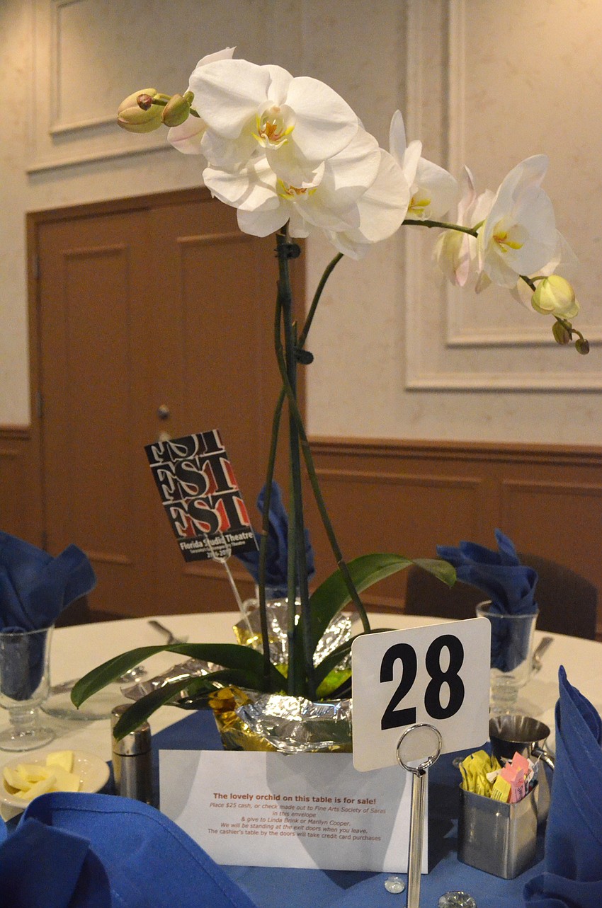 Orchid centerpieces livened up each of the tables in the ballroom.