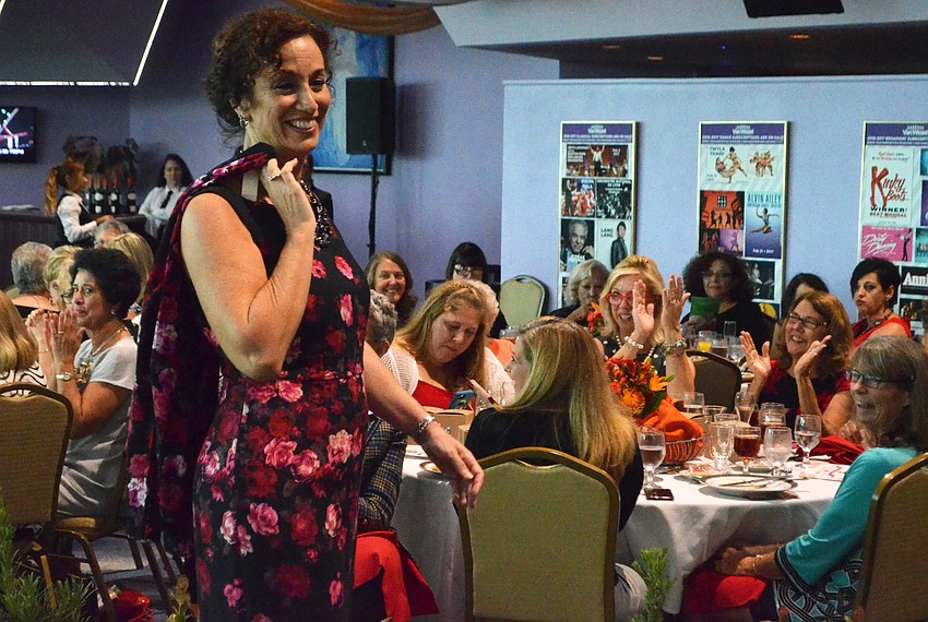 Escort Maria DeCarlo struts down the runway.