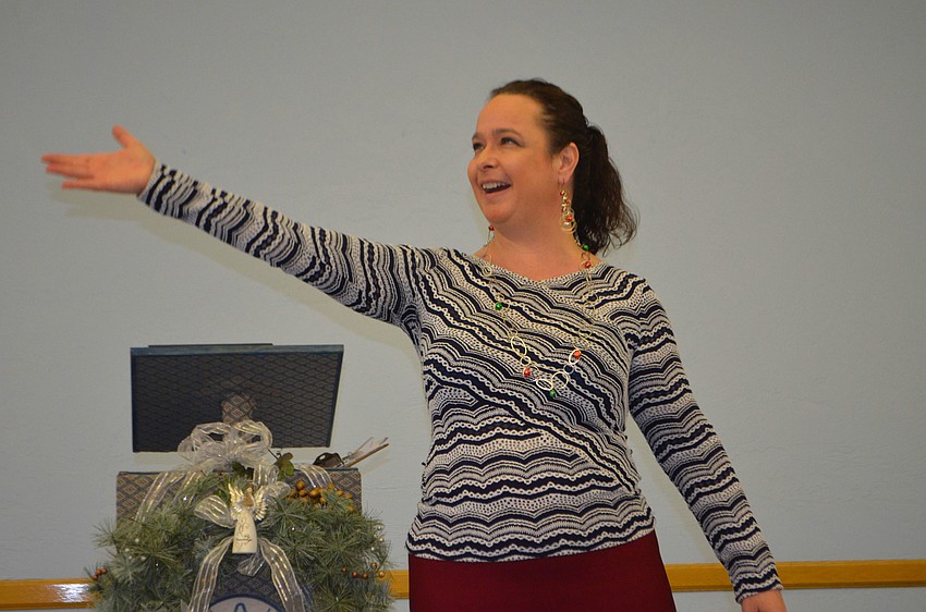 Opera singer and soloist with the St. Petersburg and Sarasota operas performed various Christmas songs during the St. Mary, Star of the Sea, Catholic Church holiday party.